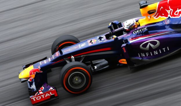 Sebastian Vettel driving the Red Bull RB9 at Sepang circuit