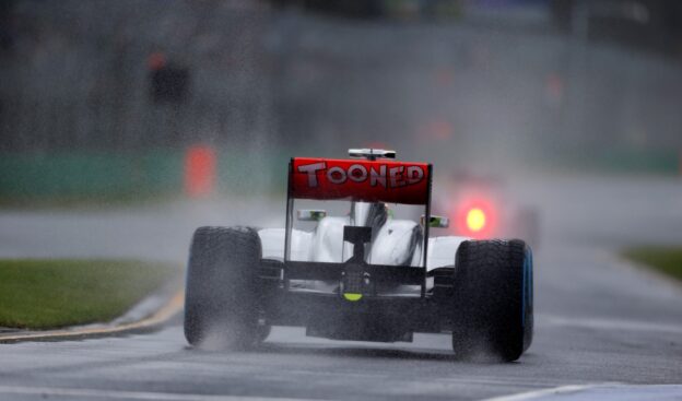 Sergio Perez leaves the pits onto a wet track