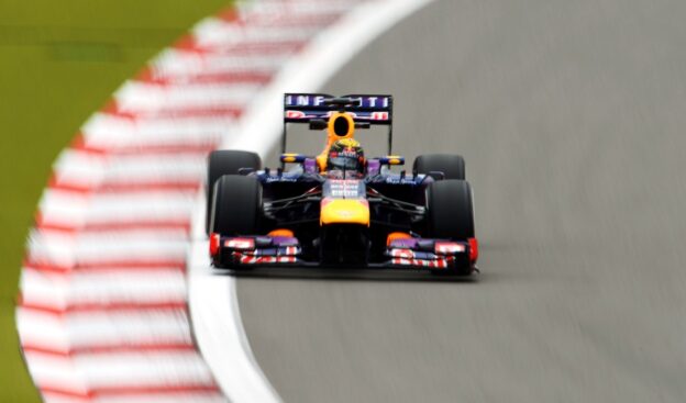 Sebastian Vettel racing his Red Bull RB9