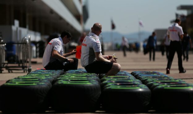 McLaren mechanics with Pirelli rain tyres