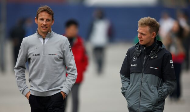 Kevin Magnussen and Jenson Button in the paddock.