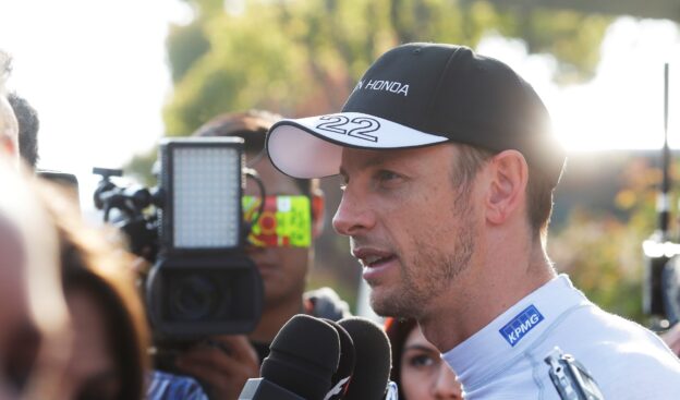 Jenson Button speaks to the media.