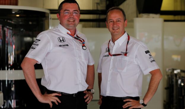 Eric Boullier and Jonathan Neale in the garage.