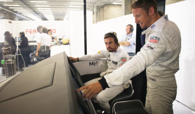 Fernando Alonso and Jenson Button in the garage.