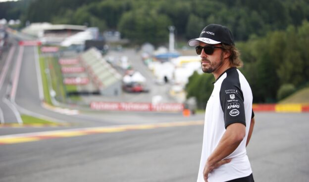 Fernando Alonso surveys Eau Rouge from the side of the track.