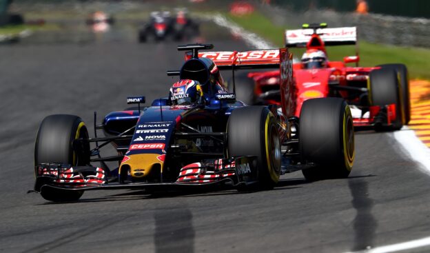 Max Verstappen in his STR10 ahead of Kimi Raikkonen in his Ferrari