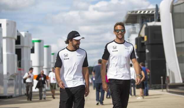 Fernando Alonso and Jenson Button in the paddock.