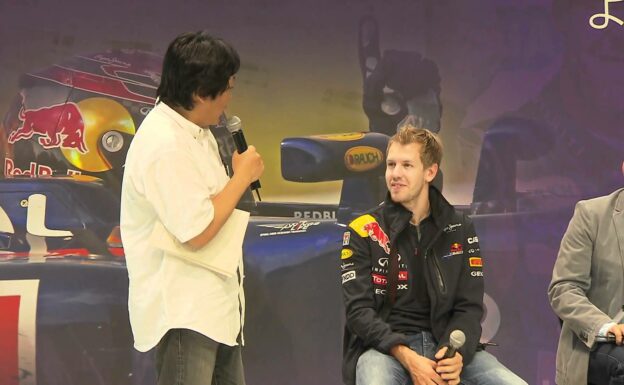 Sebastian Vettel with fans at the Nissan Hall in Yokohama Japan - 2011 F1 WC