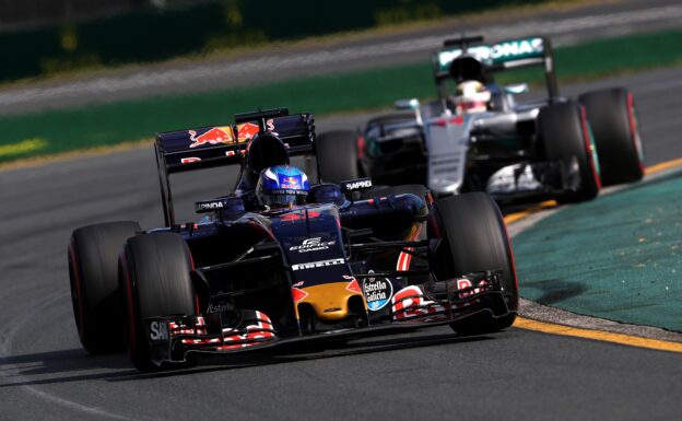 Max Verstappen driving his Toro Rosso STR11 ahead of Lewis Hamilton