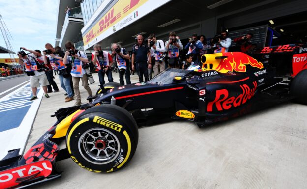 Daniel Ricciardo driving the Red Bull RB12 fitted with the aeroscreen on track during practice