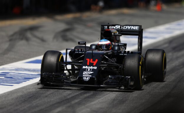 Fernando Alonso in the pit lane in his McLaren MP4-31