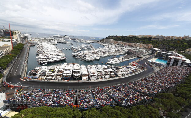 A scenic view of Monaco with Fernando Alonso on track.