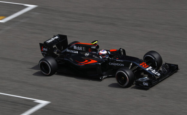 Jenson Button on the circuit in his McLaren MP4-31 Honda (2016)