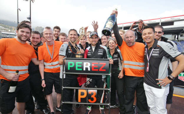 Sergio Perez celebrates his third position with the team