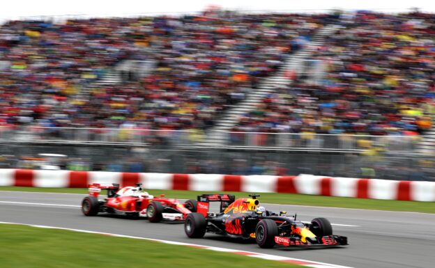 Daniel Ricciardo in his Red Bull RB12 leads Sebastian Vettel in his Ferrari SF16-H at Canada