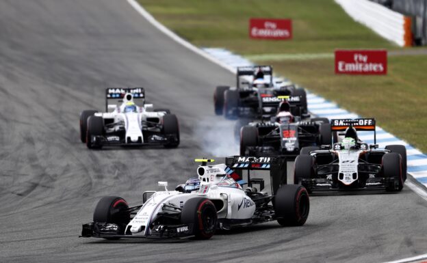 Valtteri Bottas, Williams FW38 Mercedes, leads Nico Hulkenberg, Force India VJM09 Mercedes, Jenson Button, McLaren MP4-31 Honda, and Felipe Massa, Williams FW38 Mercedes. German GP F1/2016.