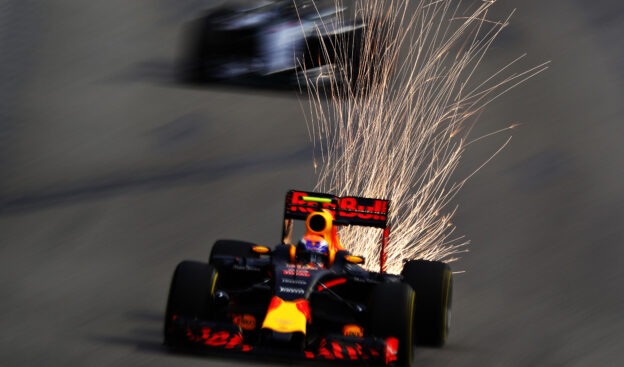 Sparks fly behind Max Verstappen on track during final practice for the Formula One Grand Prix of Singapore 2016