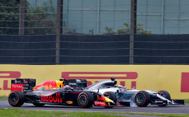 Lewis Hamilton locks a wheel under braking as he tries to overtake Max Verstappen on track during the Formula One Grand Prix of Japan 2016