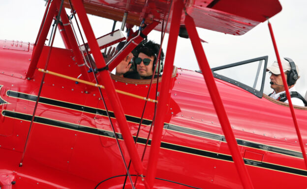 Sergio Perez Sahara Force India F1 with a biplane. United States Grand Prix 2016.