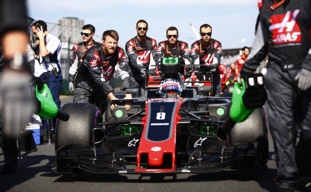 Romain Grosjean Haas VF-17 with crew on grid Albert Park, Melbourne, Australia. Sunday 26 March 2017.