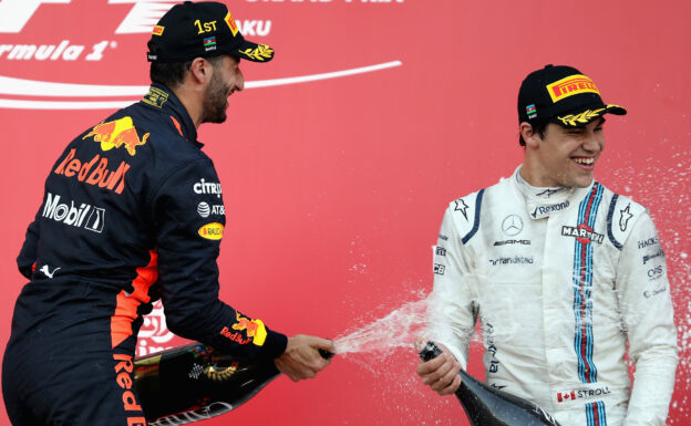 Race winner Daniel Ricciardo of Australia and Red Bull Racing celebrates his win on the podium with third placed finisher Lance Stroll of Canada and Williams during the Azerbaijan Formula One Grand Prix at Baku City Circuit on June 25, 2017 in Baku, Azerbaijan.