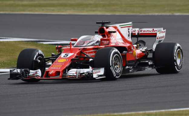 Sebastian Vettel driving the Ferrari SF70H with protection shield.