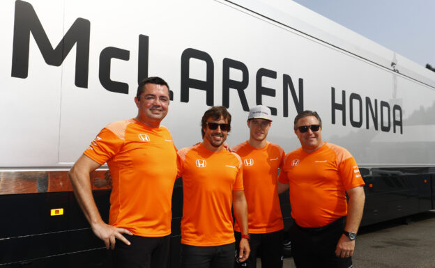 Spa Francorchamps, Belgium. Sunday 27 August 2017. Eric Boullier, Racing Director, McLaren, Fernando Alonso, McLaren, Stoffel Vandoorne, McLaren, and Zak Brown, Executive Director, McLaren Technology Group, wear celebratory orange T-shirts.