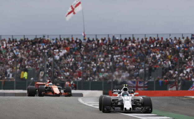 Silverstone, Northamptonshire, UK. Sunday 16 July 2017. Lance Stroll, Williams FW40 Mercedes, leads Fernando Alonso, McLaren MCL32 Honda.