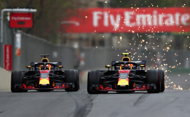 Daniel Ricciardo and Max Verstappen of the Netherlands driving the (33) Aston Martin Red Bull Racing RB14 TAG Heuer battle on track during the Azerbaijan Formula One Grand Prix 2018