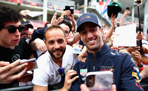 Daniel Ricciardo of Red Bull Racing poses for a selfie with a fan during previews ahead of the Spanish GP F1/2018.