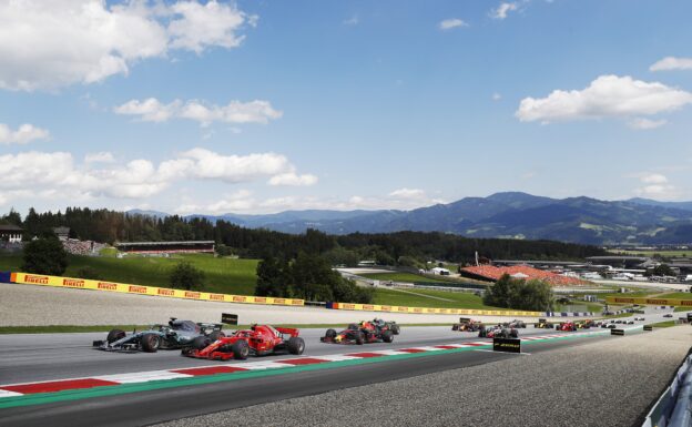 Lewis Hamilton (Mercedes) and Kimi Raikkonen (Ferrari) braking late for turn 2