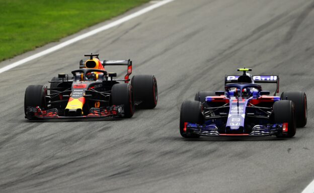 Daniel Ricciardo driving the (3) Aston Martin Red Bull Racing RB14 TAG Heuer competes with Pierre Gasly of Scuderia Toro Rosso driving the (10) Scuderia Toro Rosso STR13 Honda during the Formula One Grand Prix of Italy at Autodromo di Monza on September 2, 2018 in Monza, Italy.