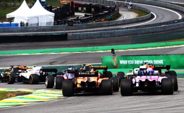 Esteban Ocon (FRA) Racing Point Force India F1 VJM11 and Stoffel Vandoorne (BEL) McLaren MCL33 at the start of the race. Brazilian Grand Prix, Sunday 11th November 2018. Sao Paulo, Brazil.